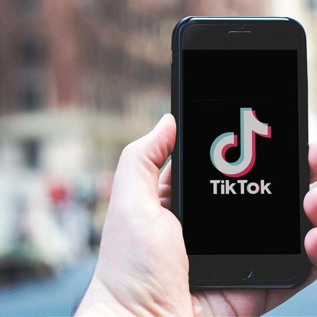 TikTok on iPhone in hand.  Photo is released under Creative Commons. Please use freely with attribution in the form of a link to nordskovmedia.dk as the image owner.