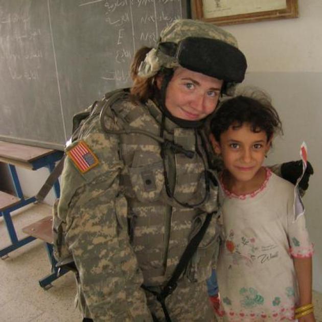 Female solider and little child