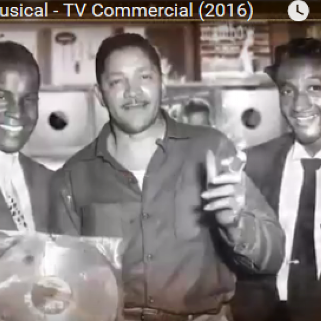 Black and white photo of three guys in recording studio