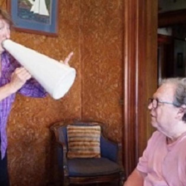 Dan Dougan yelling at Bob through a megaphone