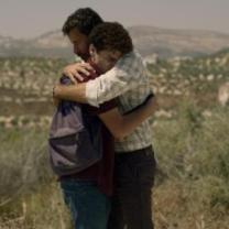 Two men hugging